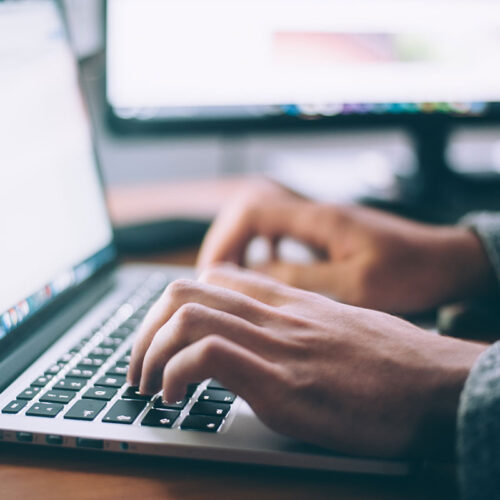 web developer working on laptop